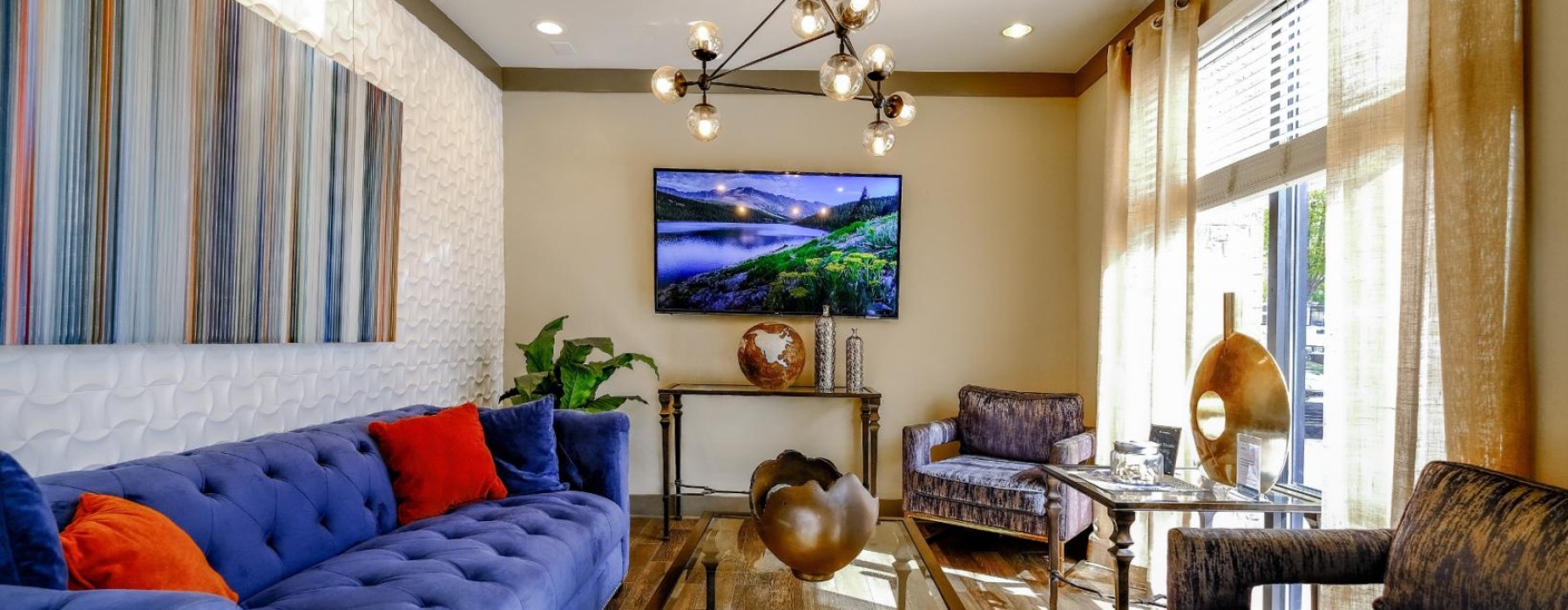 a living room with a blue couch and a table