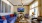 a living room with a blue couch and a table