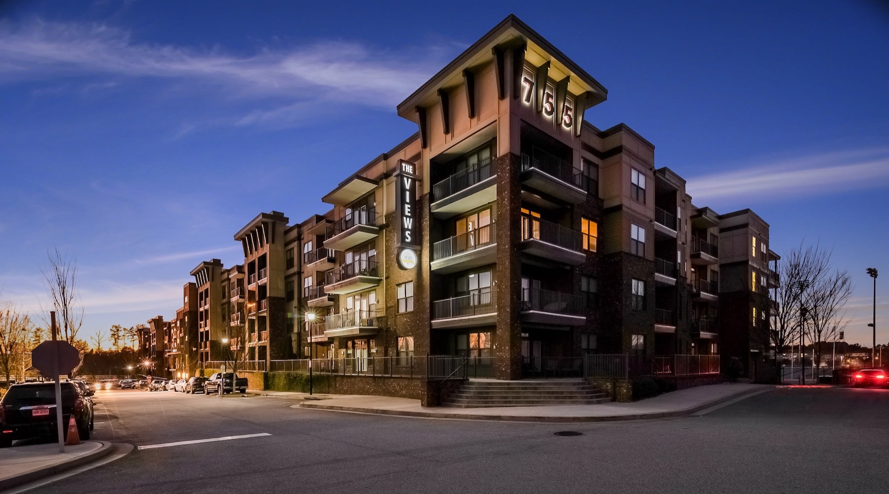 exterior of a building on a street corner with the night sky in the background